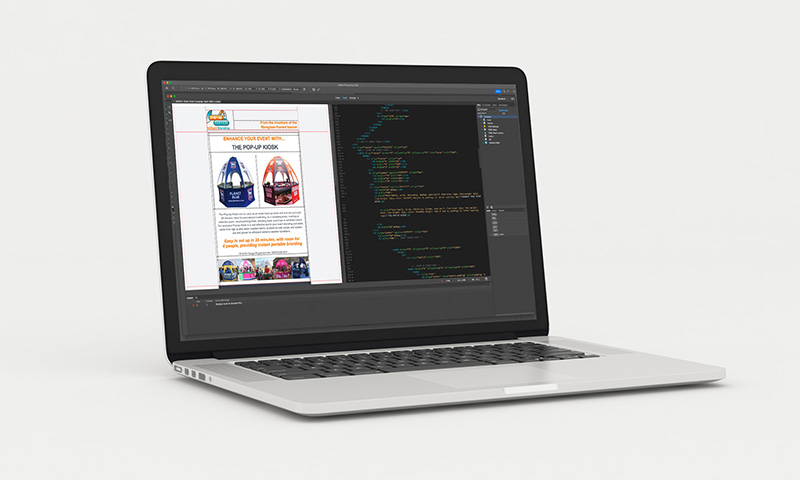 Photograph of a macbook showing the html of an email marketing campaign for Pop-up Banners